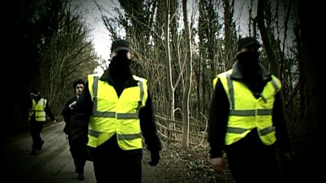 Picture of people wearing high vis vests and black shirts